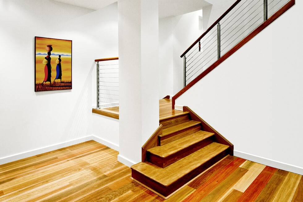 Modern residential staircase with timber treads, cable balustrades, polished timber floors, and contemporary architectural design photographed in Adelaide.