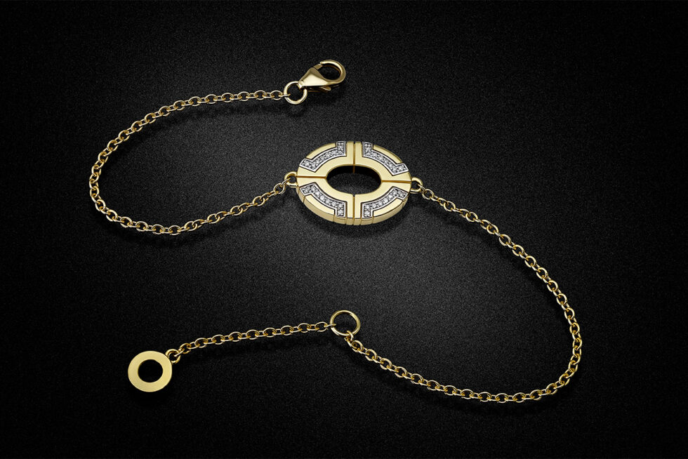 Luxury gold bracelet with diamond detailing photographed on a black background for a jewellery designer. Professional product photography by John Nieddu Photography.