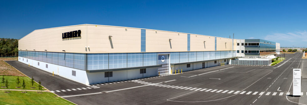 Panoramic exterior photograph of the Liebherr Australia industrial facility and offices in Adelaide, South Australia.