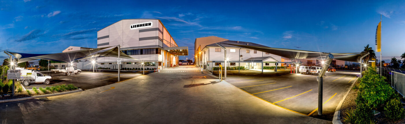 Panoramic twilight photograph of the Liebherr Australia industrial facility in Mackay, Queensland.