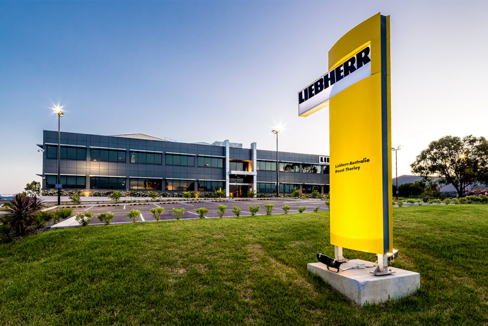 Liebherr Australia Mount Thorley headquarters photographed at dusk, showcasing modern industrial architecture and commercial facilities.