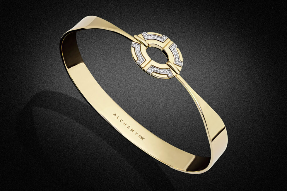 Professional product photograph of a contemporary 18K gold diamond bangle on a black background, showcasing fine craftsmanship and luxury jewellery design.